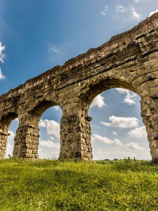 The Roman aqueducts, with their majestic arches and precisely calculated slope, were hydraulic engineering systems that extracted water from distant sources, purified it along the way, and distributed it through underground networks for both public and private use, showcasing Roman ingenuity in water supply.